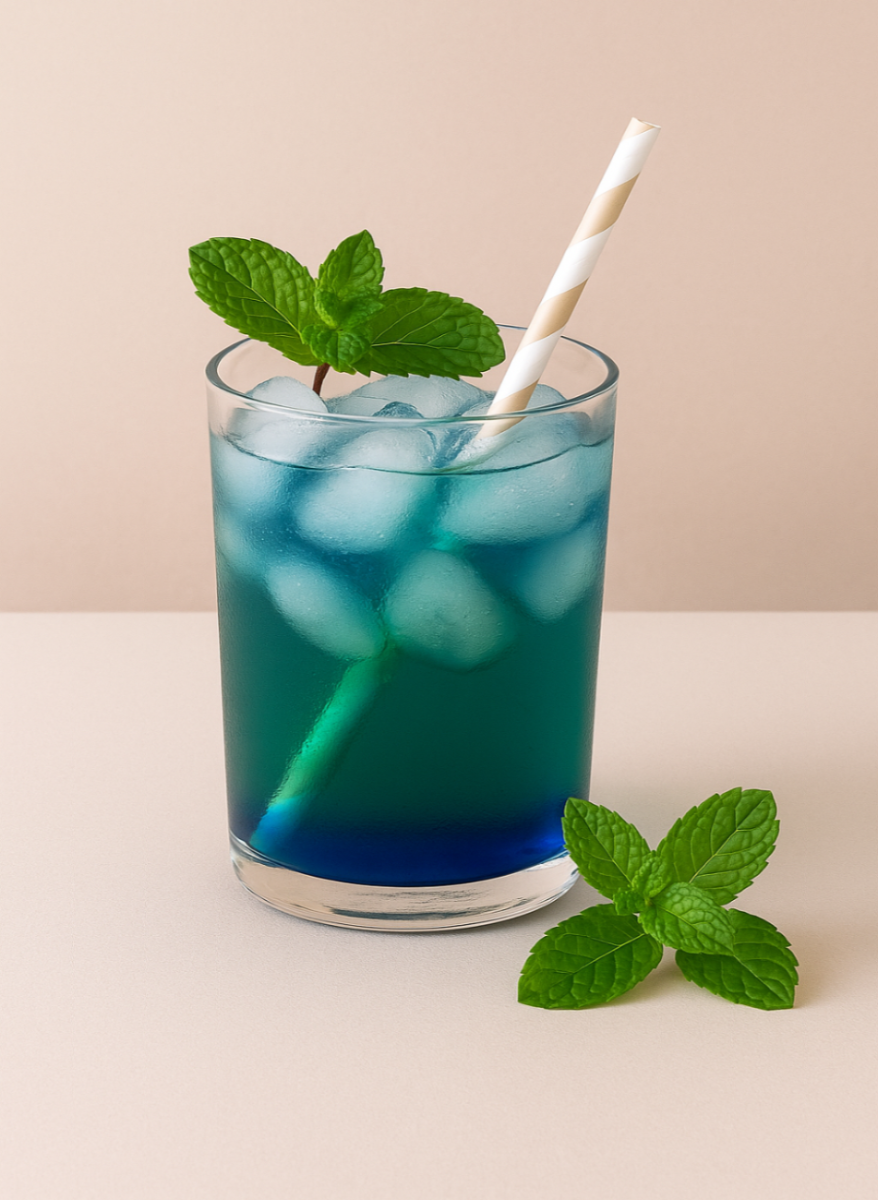 Spearmint Blue Tea Cooler mocktail by WarmHugs — a detoxifying, minty iced herbal tea blend ideal for digestion and refreshing hydration.